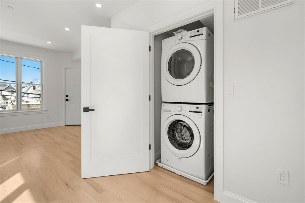 53 Dustin Street, Unit 2 Boston, MA 02135 - Photo 17 of 21 a utility room with dryer and washer