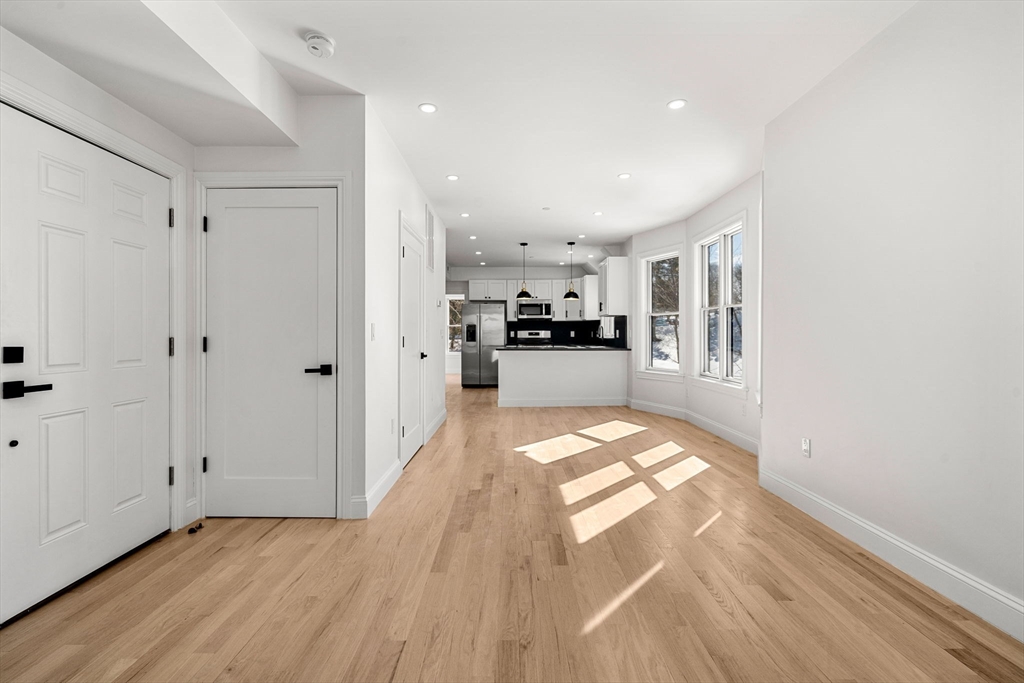 53 Dustin Street, Unit 2 Boston, MA 02135 - Photo 7 of 21 a view of a kitchen with wooden floor and a kitchen