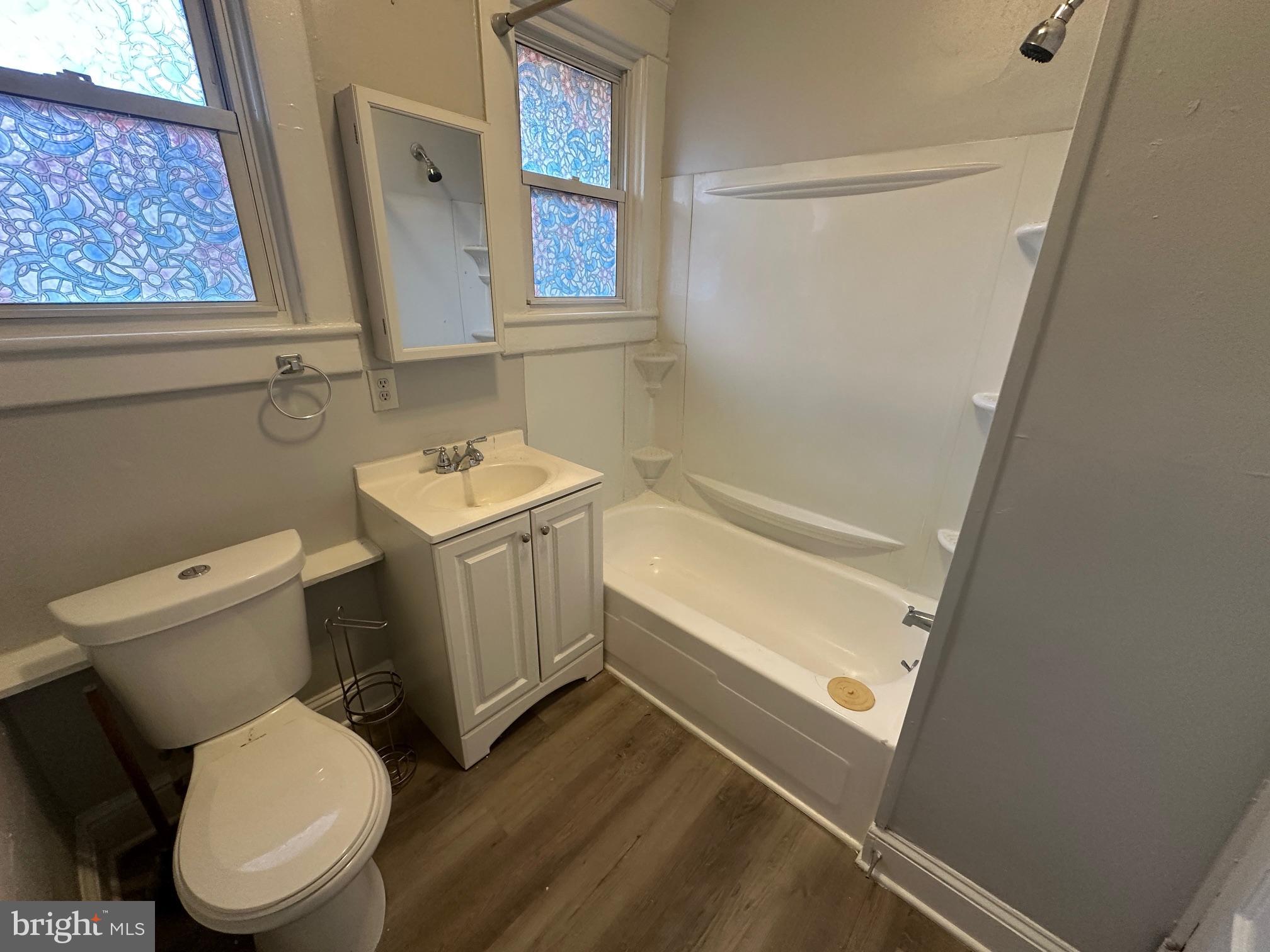 416 Cleveland Road Linthicum Heights, MD 21090 - Photo 13 of 17 a white toilet sitting next to a bath tub