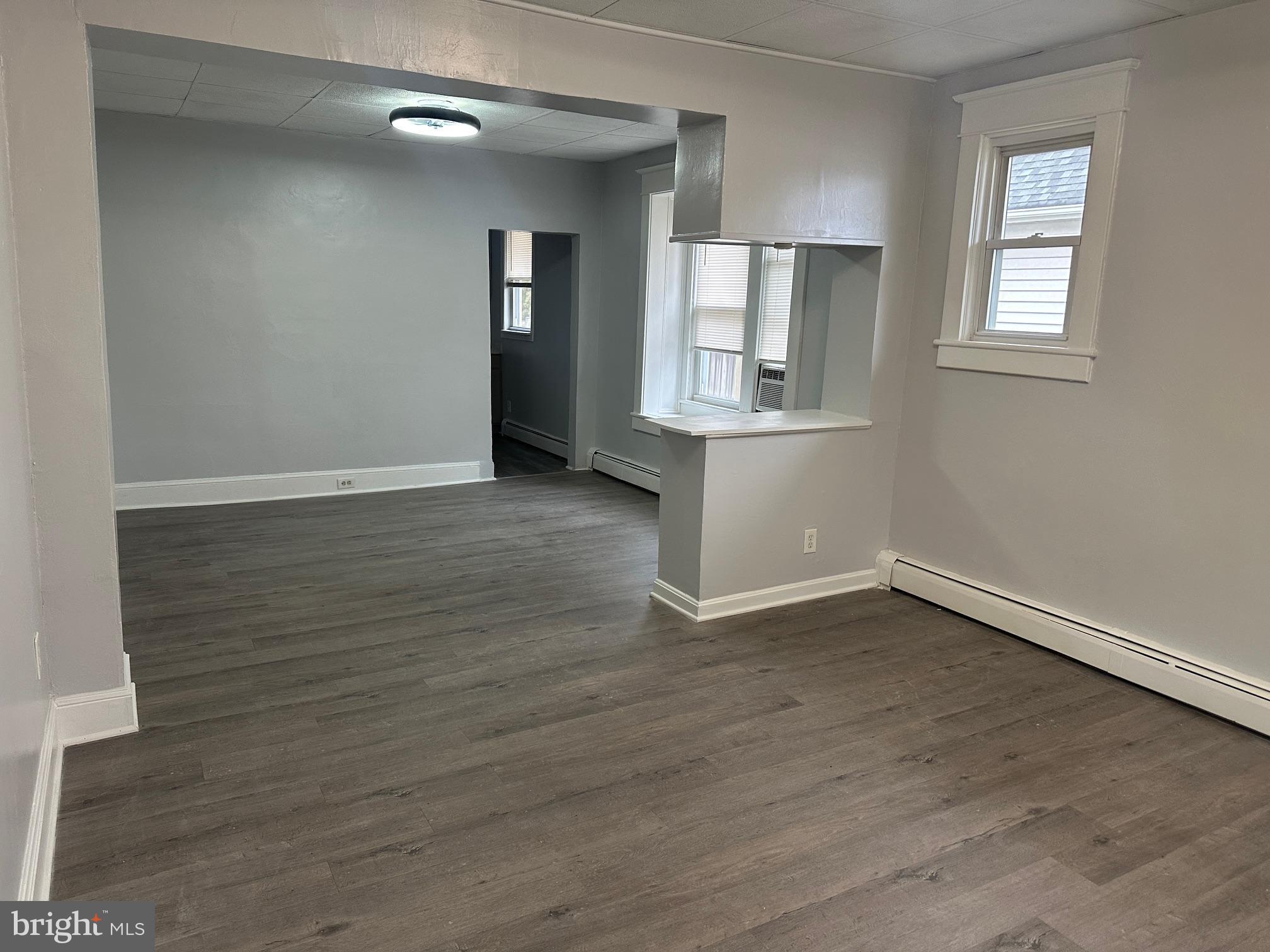 416 Cleveland Road Linthicum Heights, MD 21090 - Photo 5 of 17 an empty room with wooden floor and windows