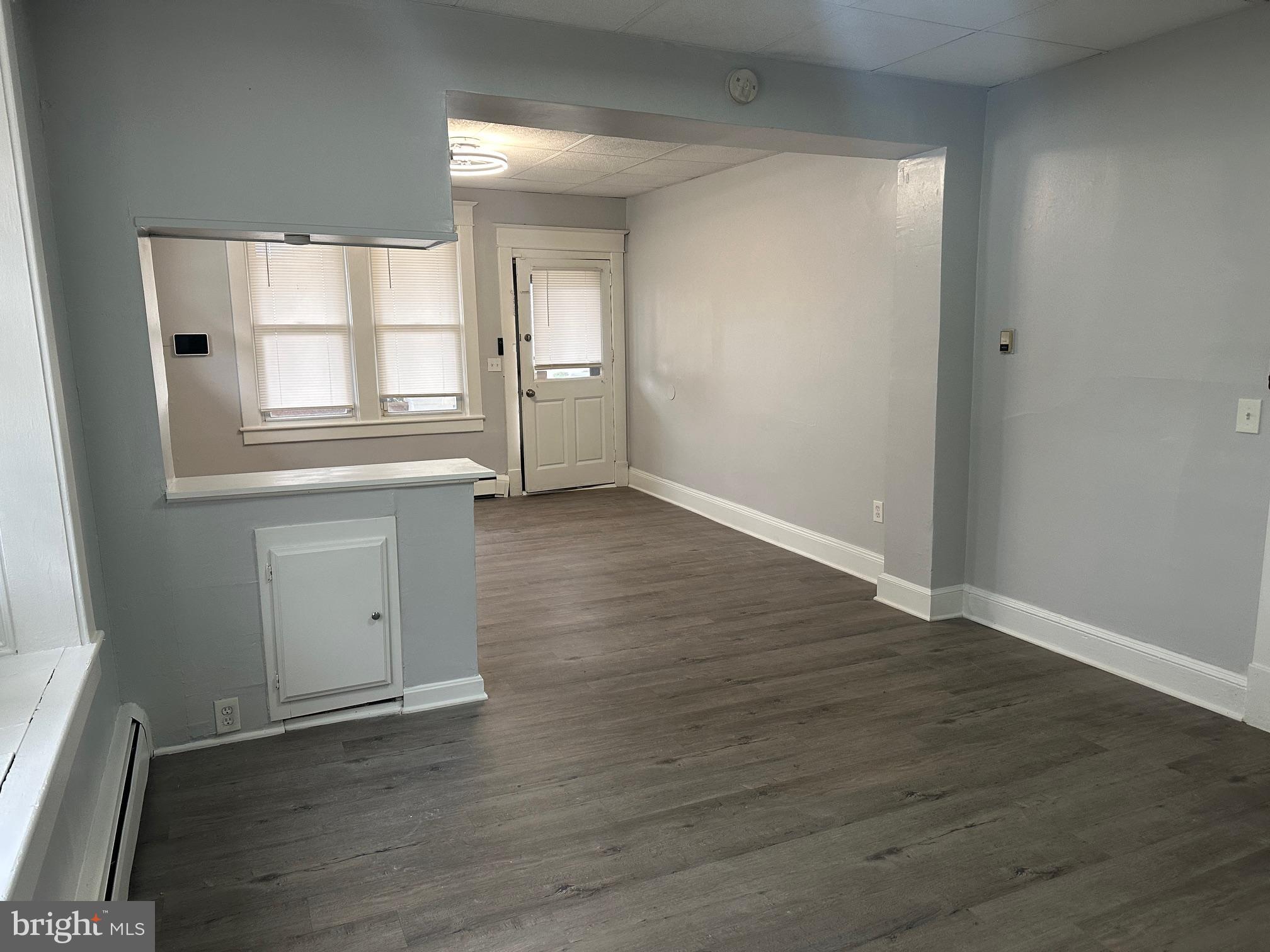 416 Cleveland Road Linthicum Heights, MD 21090 - Photo 6 of 17 an empty room with wooden floor and windows