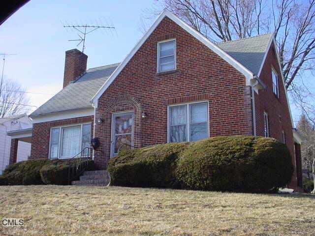 2478 Old Town Road Bridgeport, CT 06606 - Photo 1 of 1 a view of a brick house with a yard