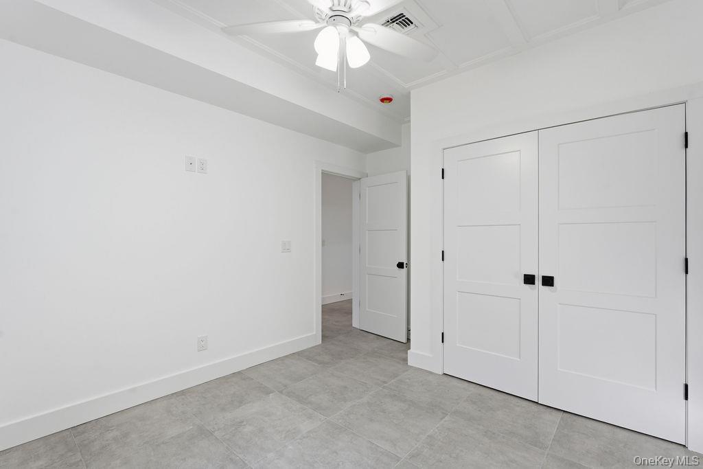 768 Bridgehampton Sag Harbor Bridgehampton, NY 11932 - Photo 12 of 35 Unfurnished bedroom featuring a closet and ceiling fan