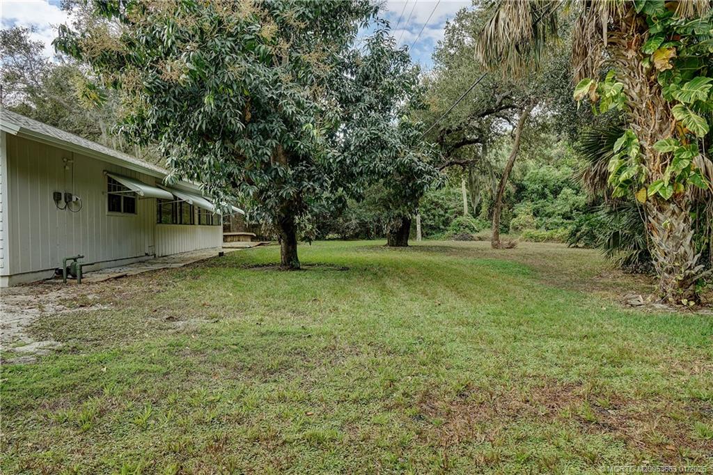 4 Miramar Road Sewall's Point, FL 34996 - Photo 25 of 31 a view of outdoor space with deck and yard