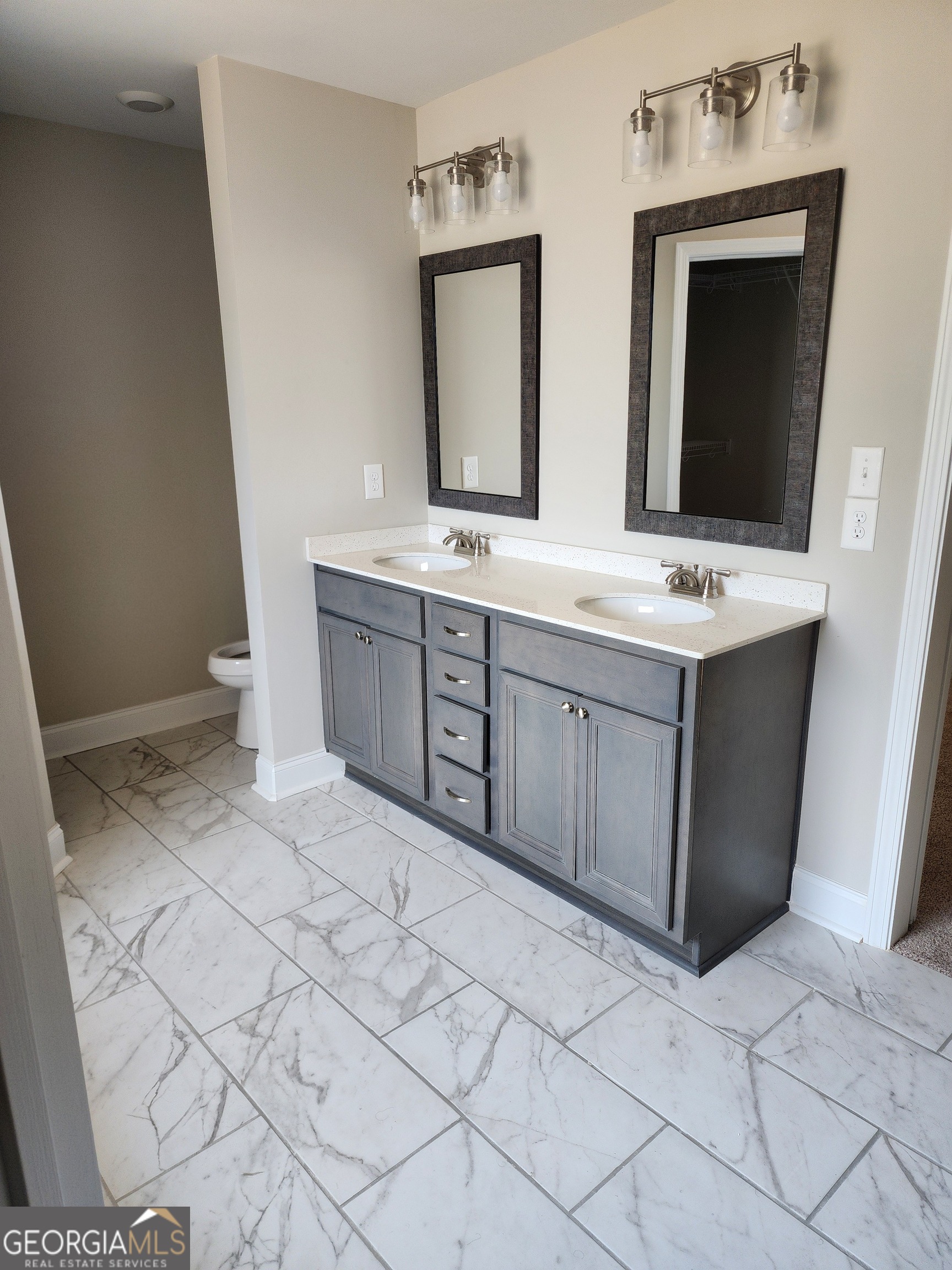 110 Rocky Road Perry, GA 31069 - Photo 6 of 10 a bathroom with a sink vanity and mirror