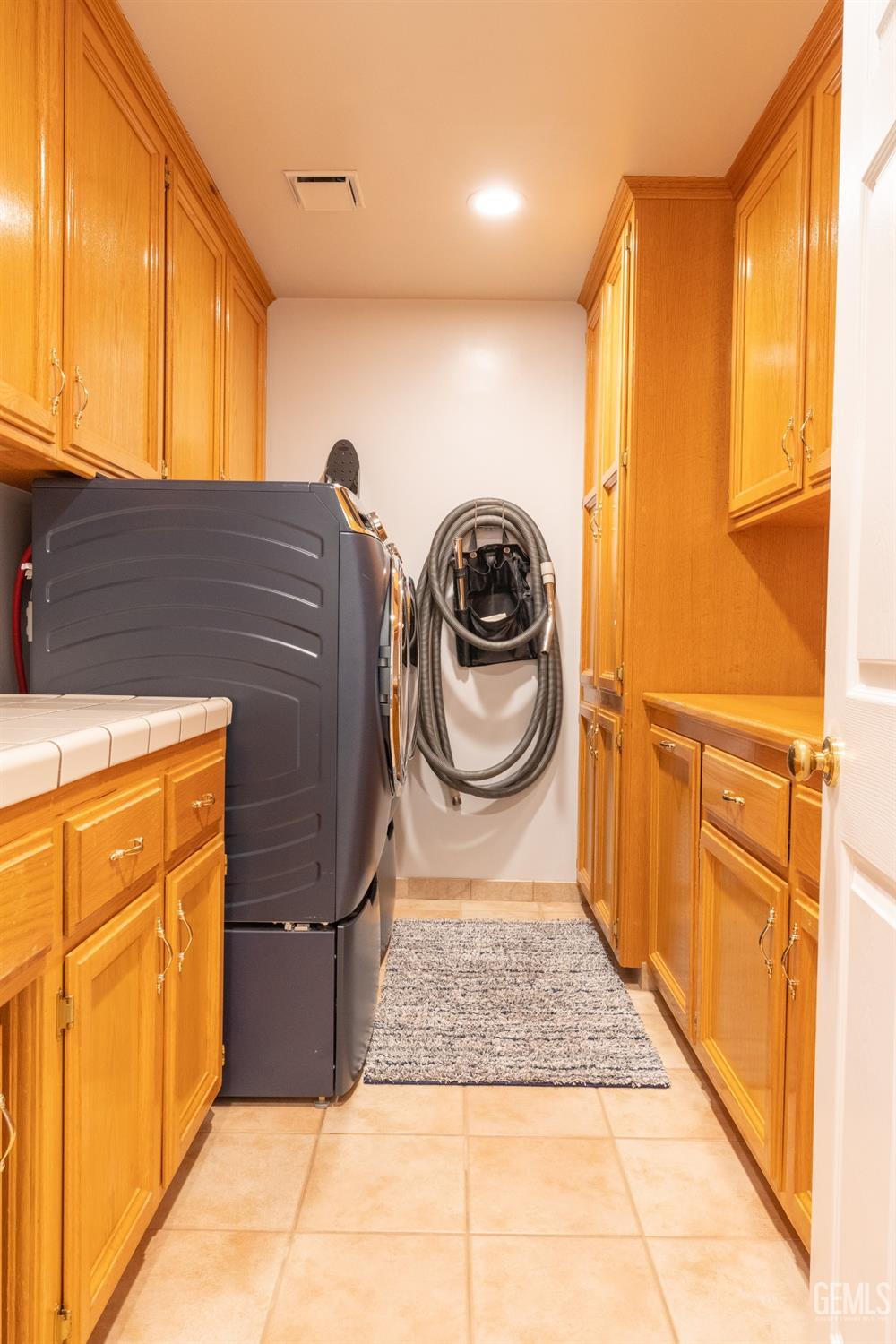 Undisclosed Address Bakersfield, CA 93314 - Photo 17 of 23 a utility room with sink dryer and washer