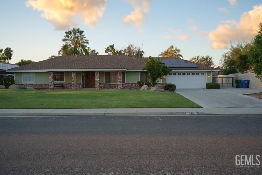 Undisclosed Address Bakersfield, CA 93314 - Photo 23 of 23 a front view of a house with a yard