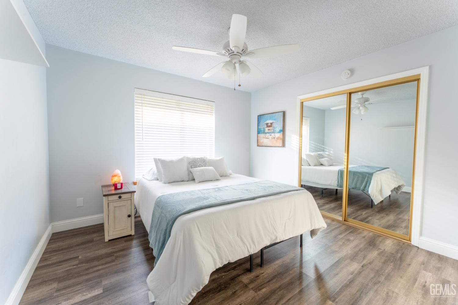 Undisclosed Address Bakersfield, CA 93314 - Photo 5 of 23 a bedroom with a bed and a table