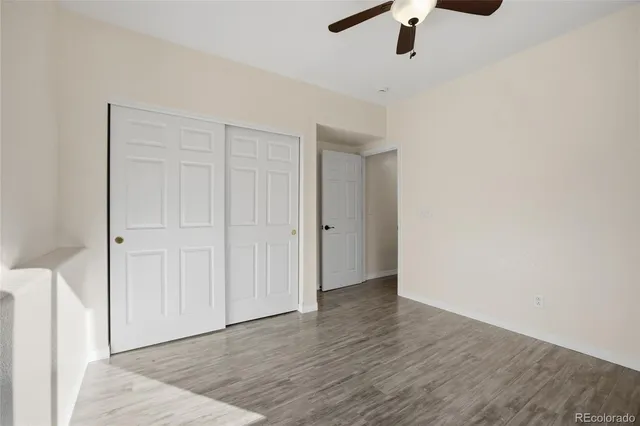 a view of an empty room and wooden floor