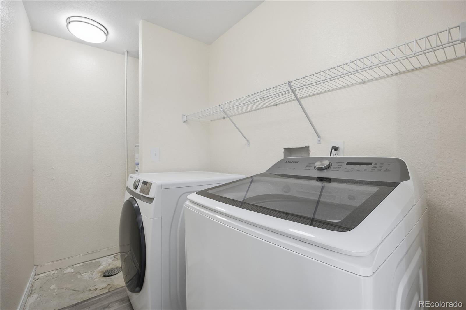 4531 Gibraltar Street Denver, CO 80249 - Photo 20 of 24 a utility room with dryer and washer