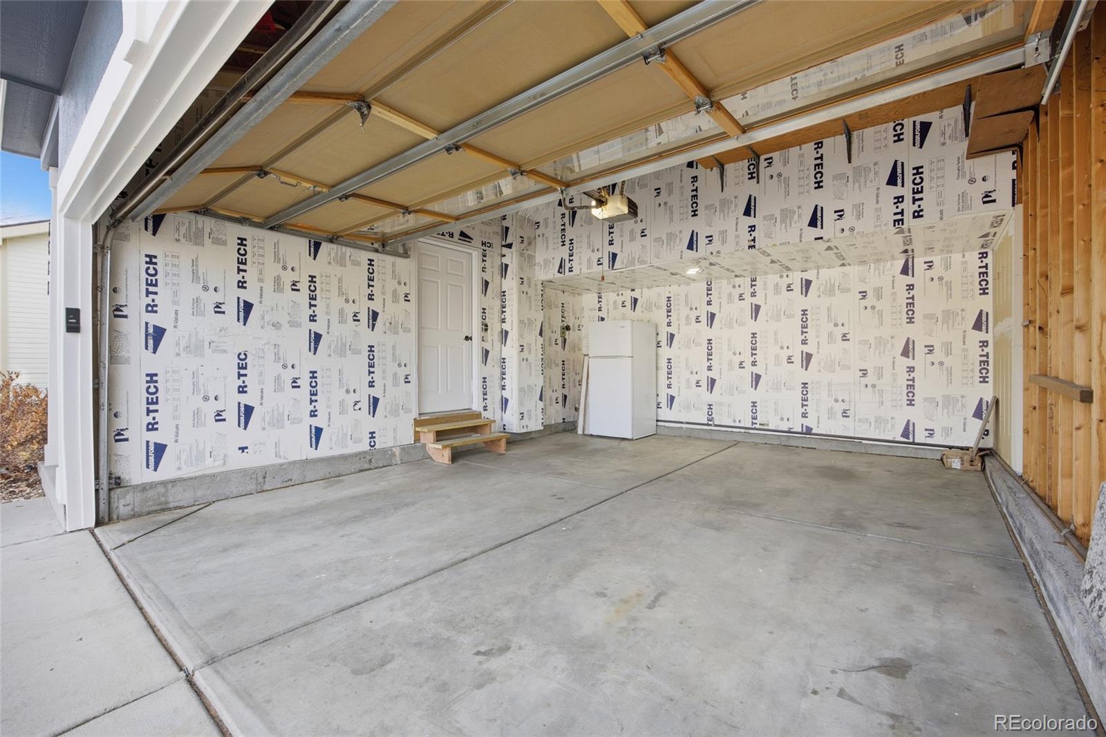 4531 Gibraltar Street Denver, CO 80249 - Photo 21 of 24 a view of a room with stairs