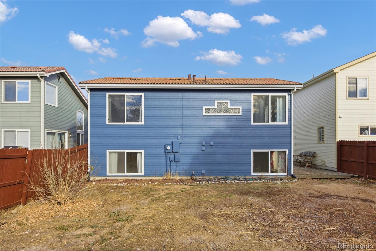 4531 Gibraltar Street Denver, CO 80249 - Photo 22 of 24 a front view of a house with a yard