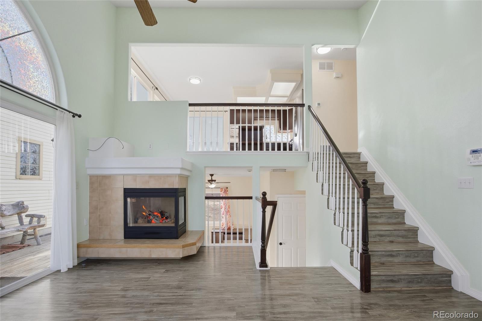 4531 Gibraltar Street Denver, CO 80249 - Photo 7 of 24 a view of entryway and hall with wooden floor