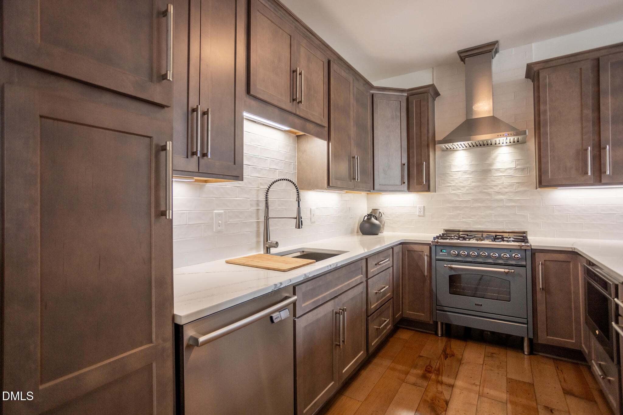 708 Constitution Drive, Unit F Durham, NC 27705 - Photo 13 of 48 a kitchen with stainless steel appliances granite countertop a sink stove and refrigerator