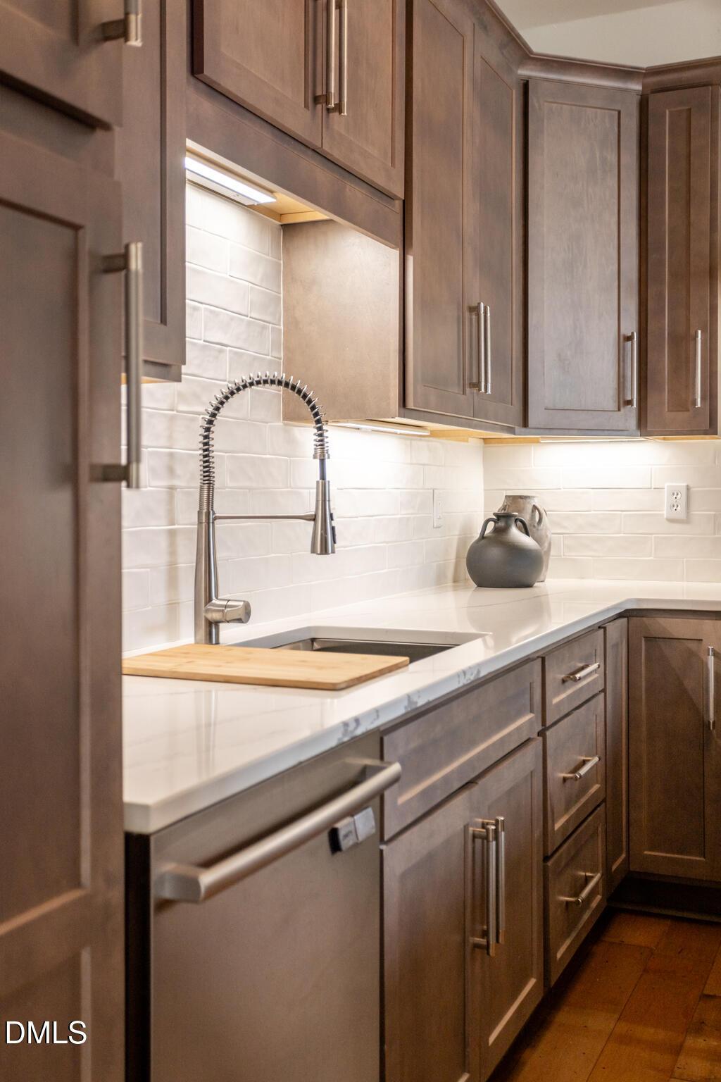 708 Constitution Drive, Unit F Durham, NC 27705 - Photo 15 of 53 a kitchen with a sink and cabinets