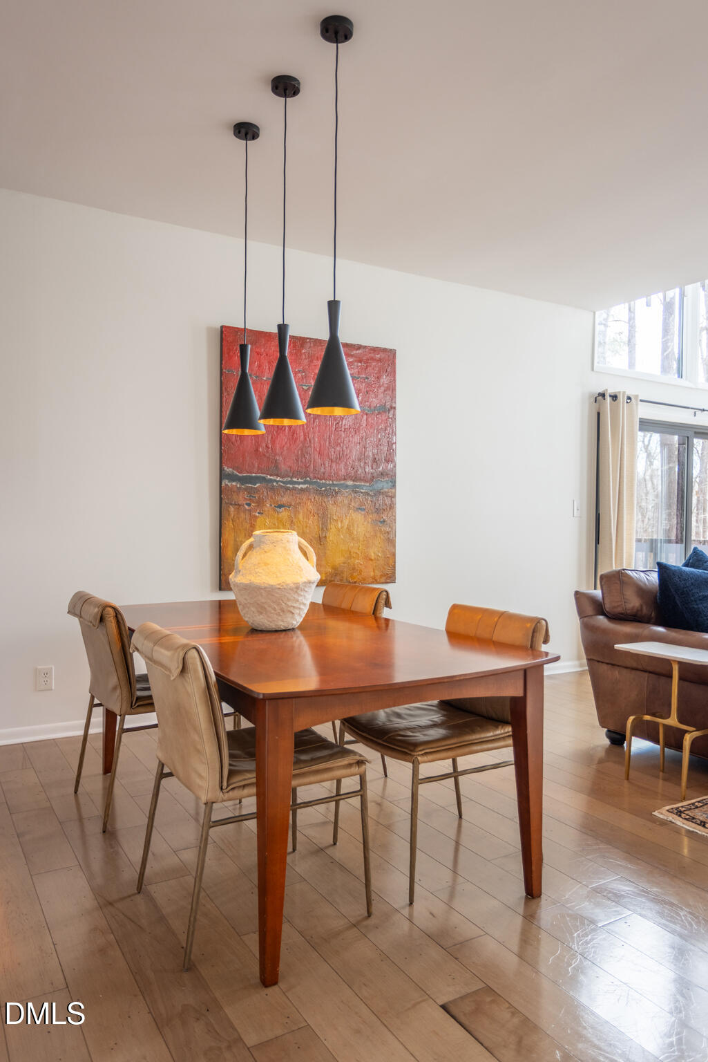 708 Constitution Drive, Unit F Durham, NC 27705 - Photo 19 of 53 a view of a dining room with furniture and wooden floor