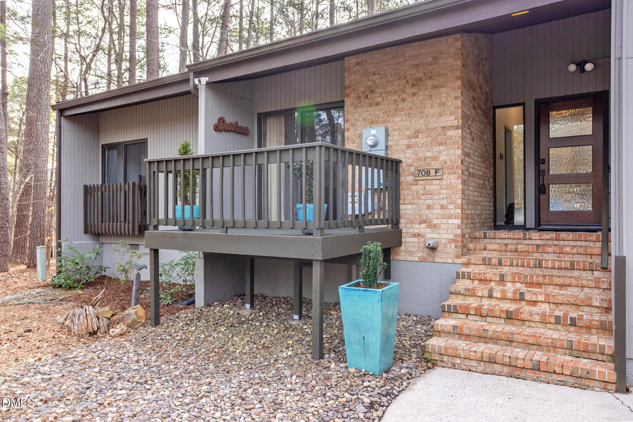 708 Constitution Drive, Unit F Durham, NC 27705 - Photo 2 of 53 a front view of a house with deck