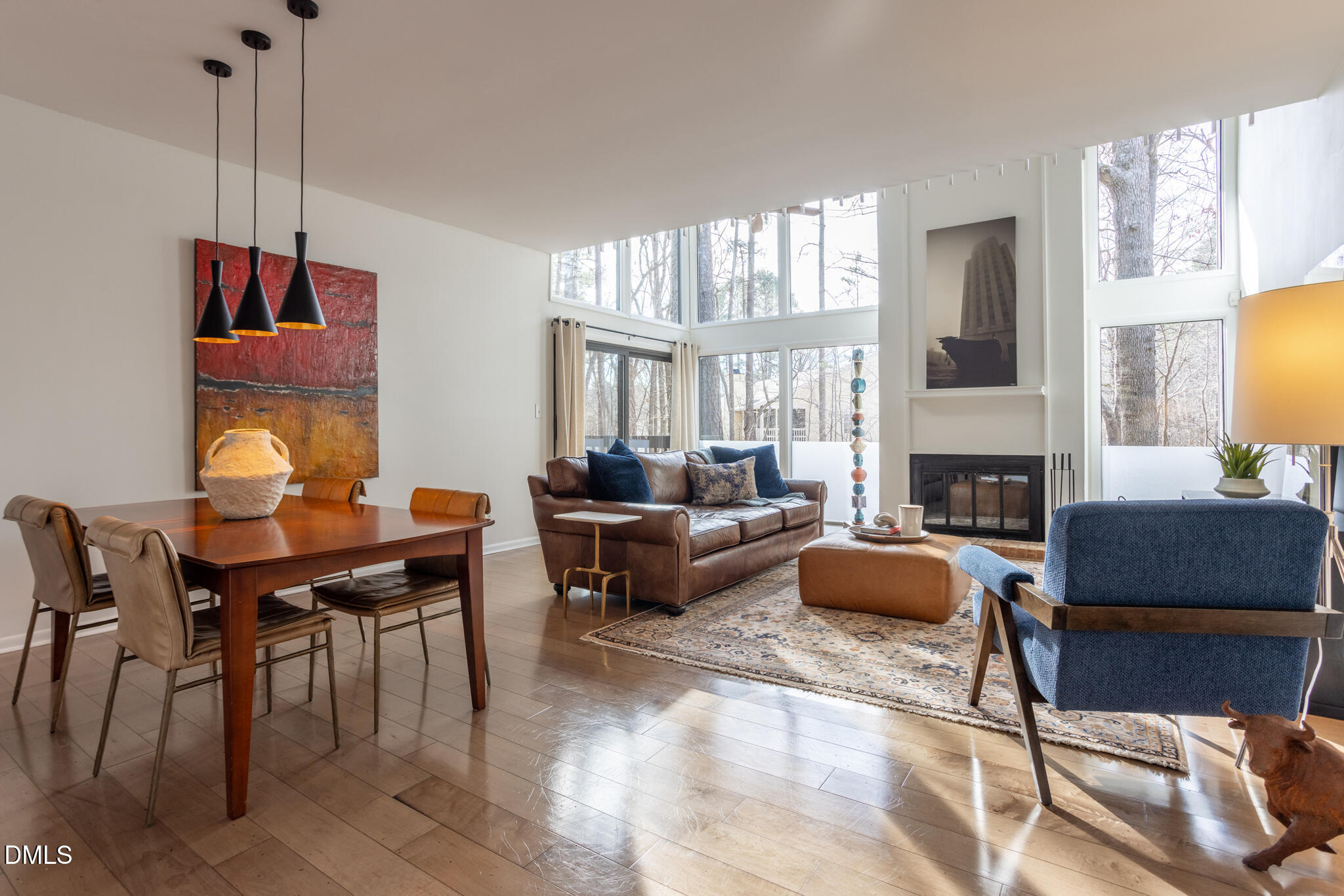 708 Constitution Drive, Unit F Durham, NC 27705 - Photo 21 of 53 a living room with furniture a fireplace and a flat screen tv