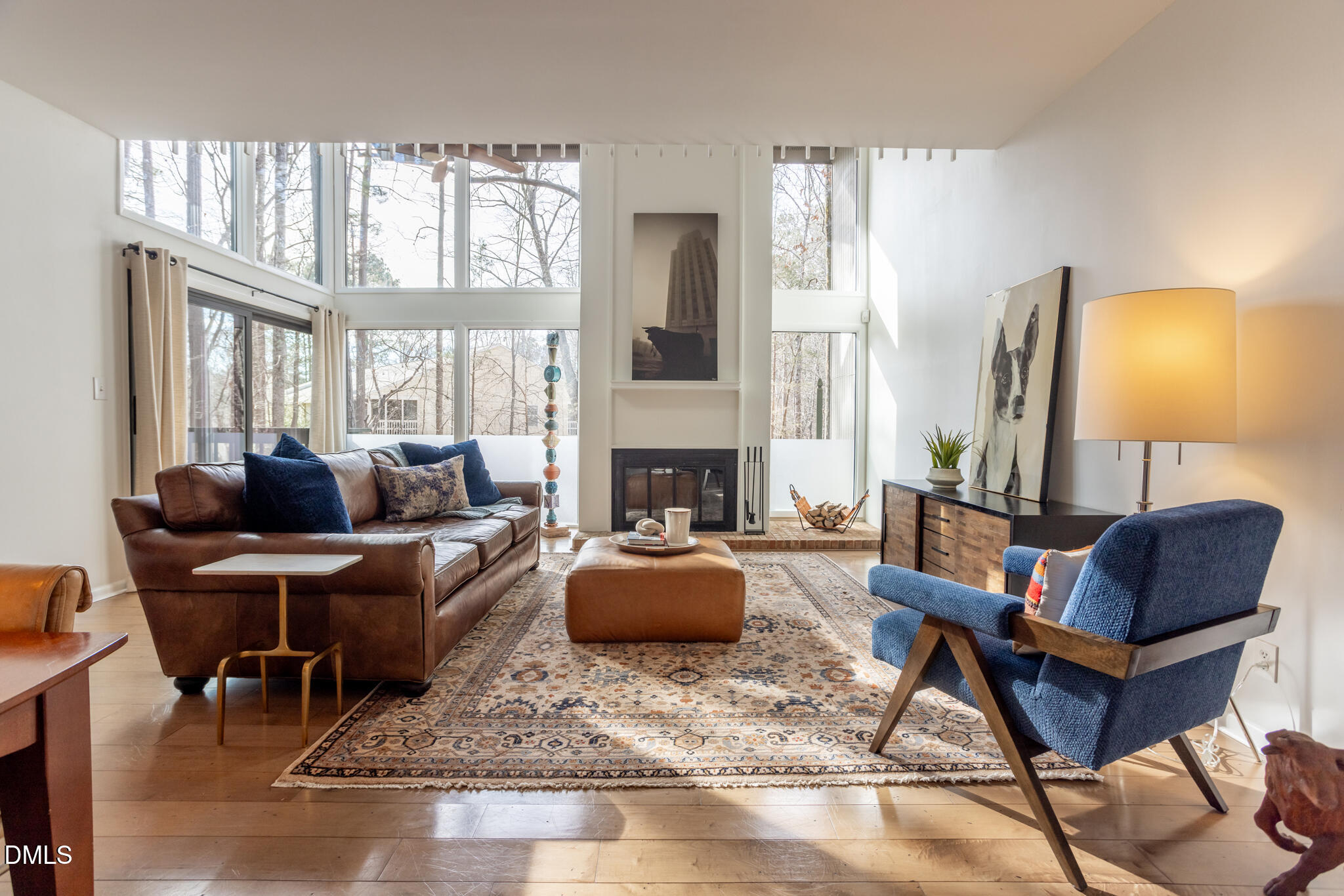 708 Constitution Drive, Unit F Durham, NC 27705 - Photo 22 of 53 a living room with furniture fireplace and a large window