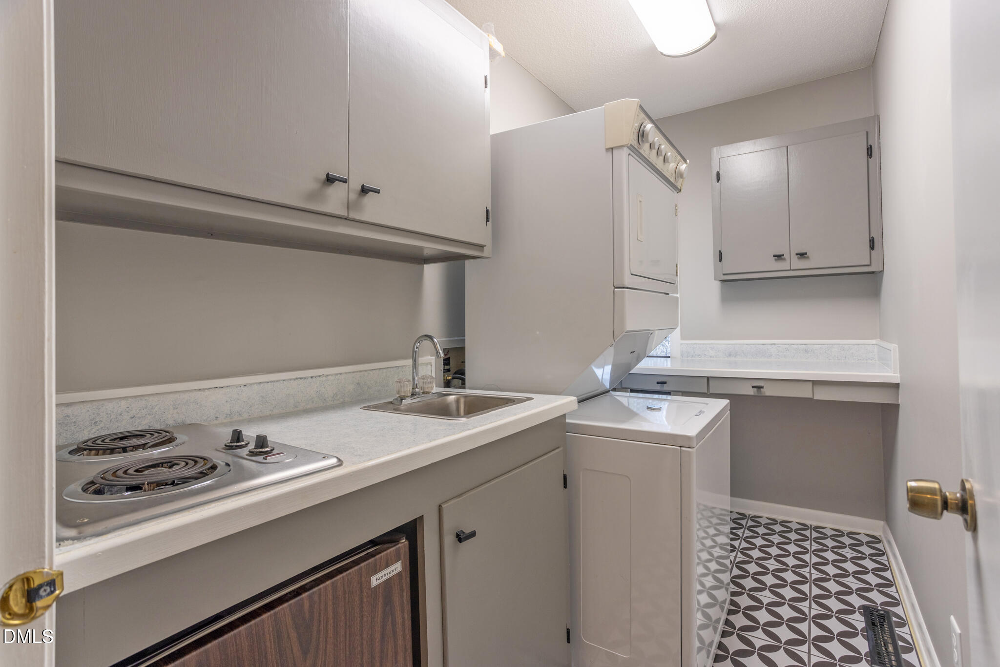 708 Constitution Drive, Unit F Durham, NC 27705 - Photo 28 of 53 a kitchen with a sink stove and cabinets