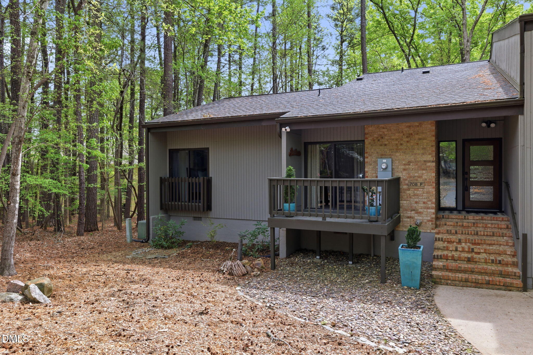 708 Constitution Drive, Unit F Durham, NC 27705 - Photo 3 of 48 a front view of a house with a porch