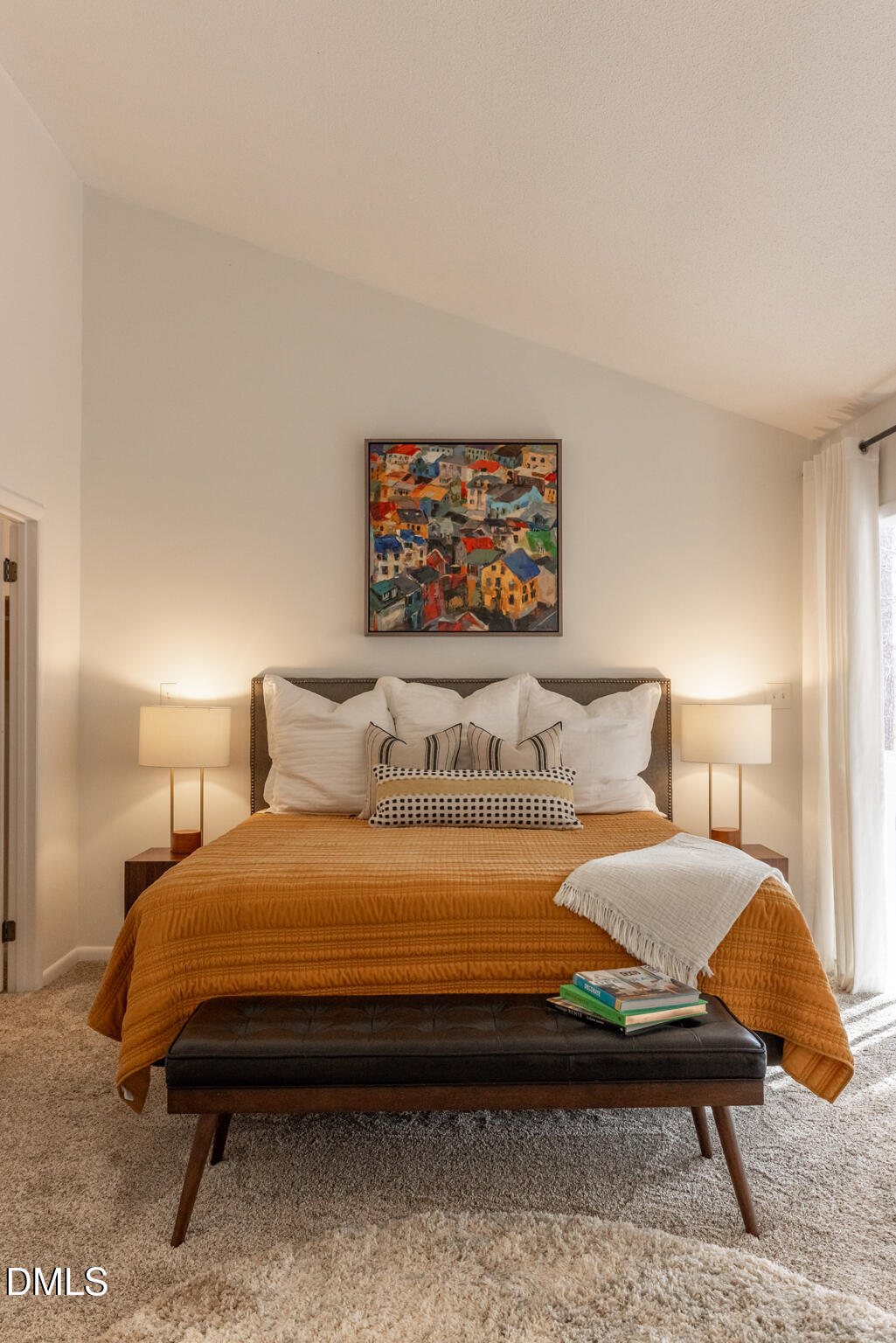 708 Constitution Drive, Unit F Durham, NC 27705 - Photo 37 of 53 a bedroom with a bed a wall painting and a lamp