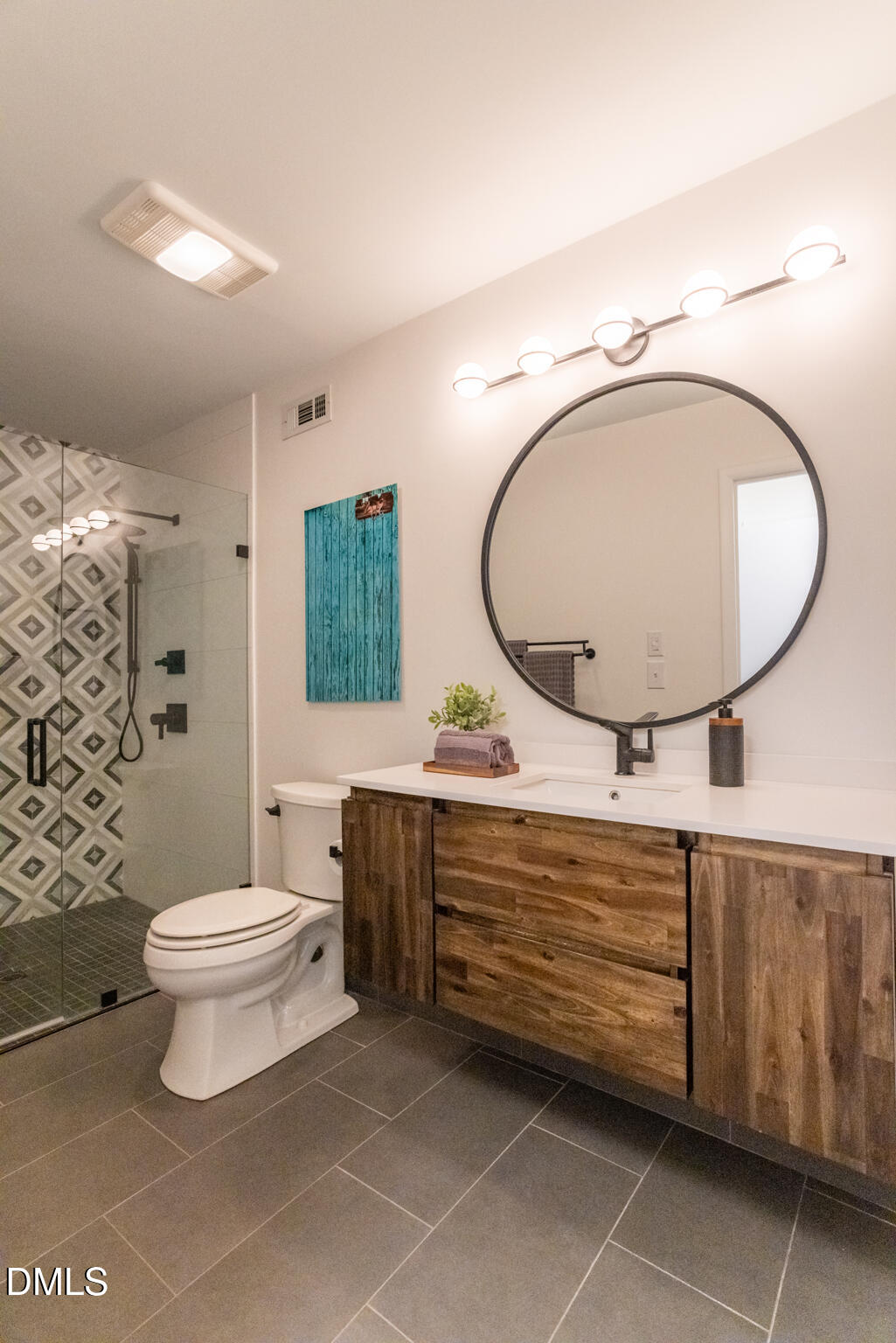 708 Constitution Drive, Unit F Durham, NC 27705 - Photo 39 of 53 a bathroom with a toilet a sink and a mirror