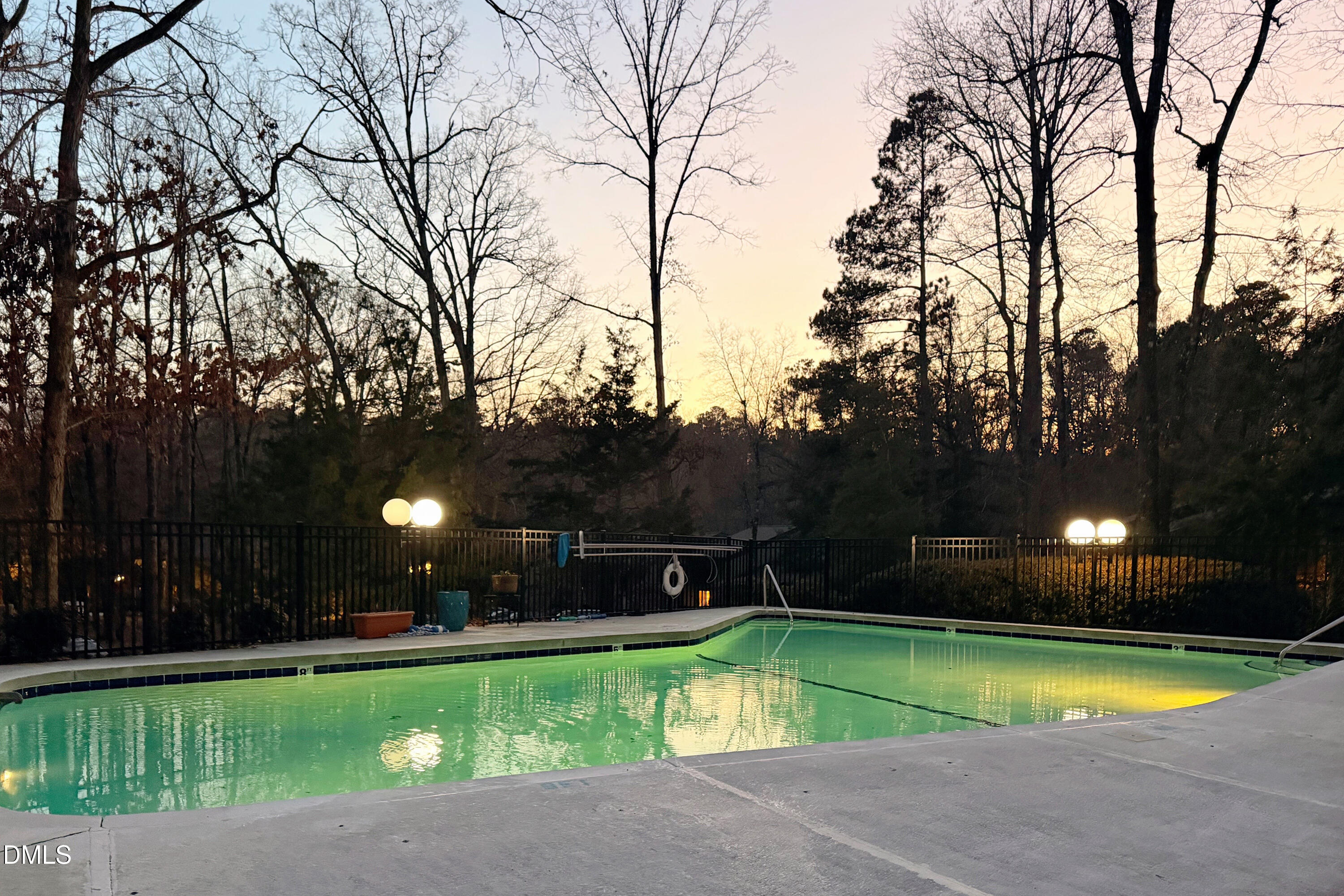 708 Constitution Drive, Unit F Durham, NC 27705 - Photo 53 of 53 a view of a swimming pool and trees in the background