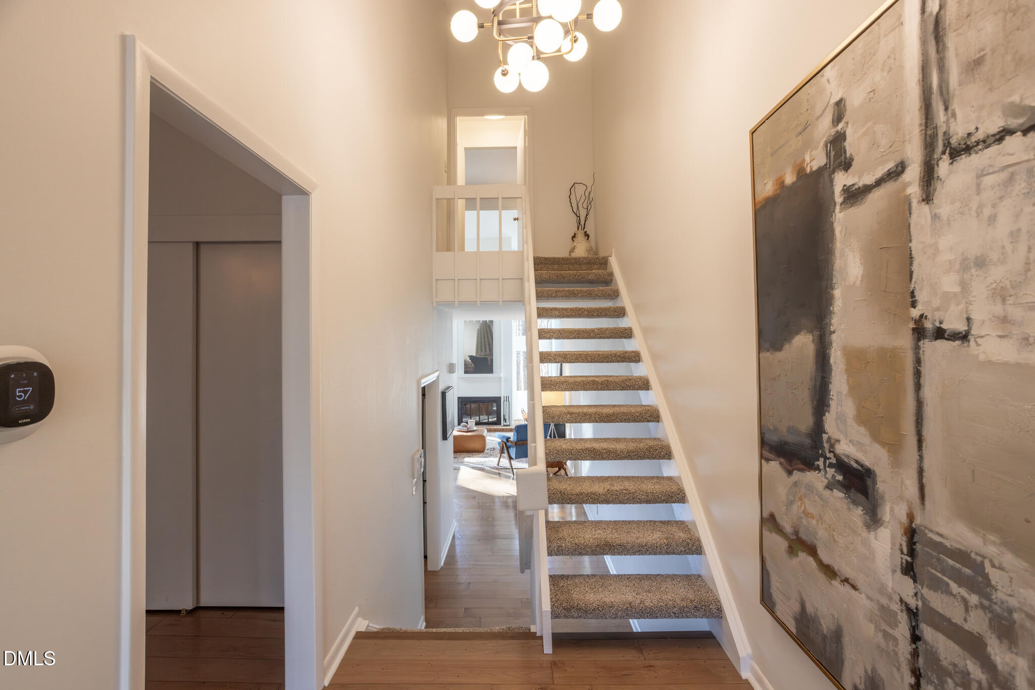 708 Constitution Drive, Unit F Durham, NC 27705 - Photo 6 of 53 a view of a hallway with wooden floor and entryway