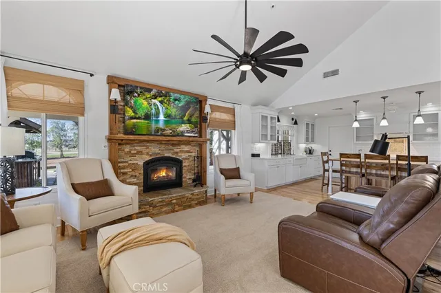 a view of a livingroom with furniture window and wooden floor