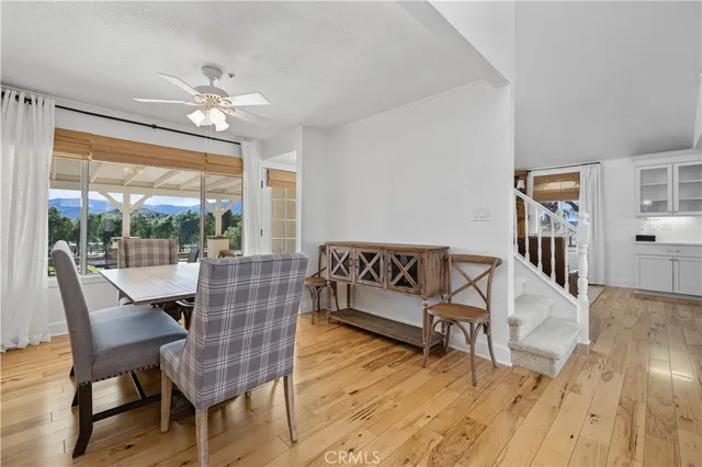 a spacious bedroom with a bed and a flat screen tv