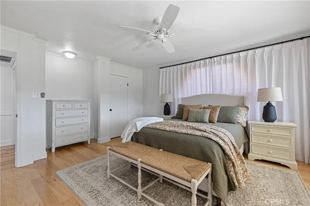a bathroom with a granite countertop sink a mirror and shower