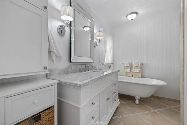 a bed room with a bed and a chandelier