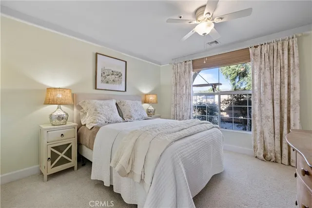 a hallway with furniture and wooden floor