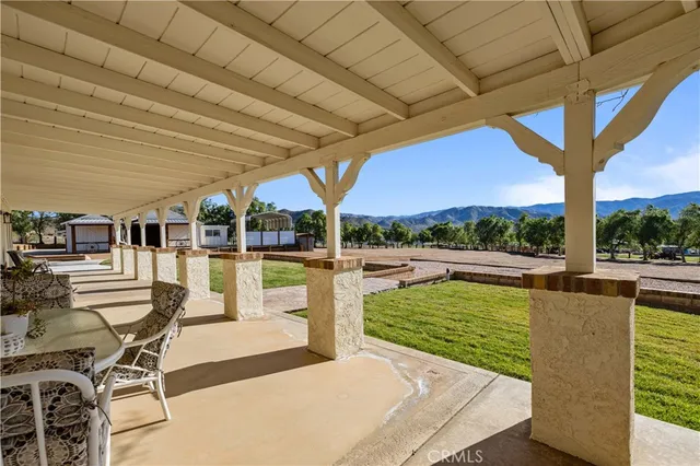 a bathroom with a granite countertop toilet sink and shower