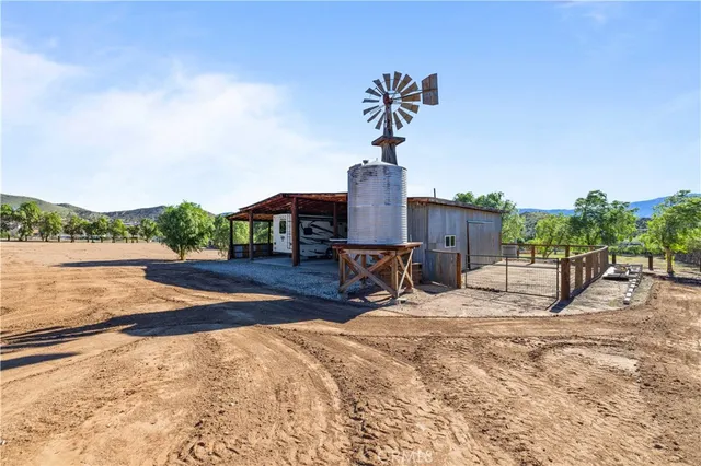 a picture of a room with a white wall and white refrigerator