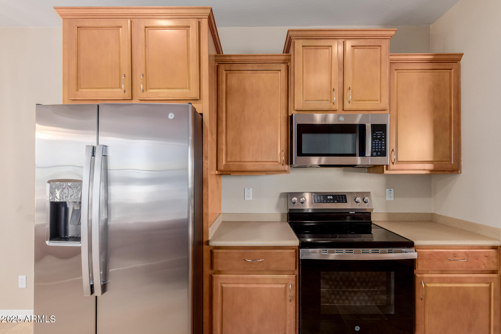 32270 Echo Canyon Road San Tan Valley, AZ 85143 - Photo 11 of 28 a kitchen with stainless steel appliances granite countertop a refrigerator stove and microwave