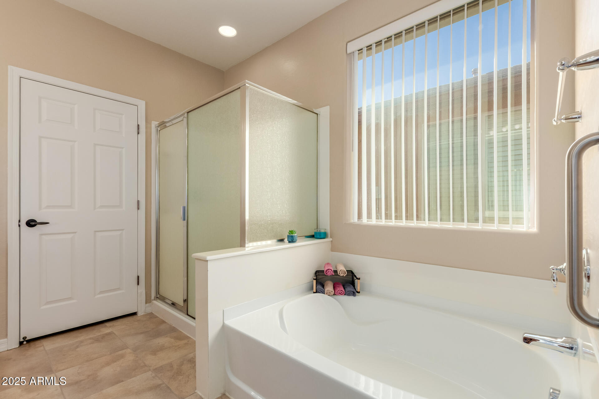 32270 Echo Canyon Road San Tan Valley, AZ 85143 - Photo 18 of 28 a bathroom with a bathtub and a shower