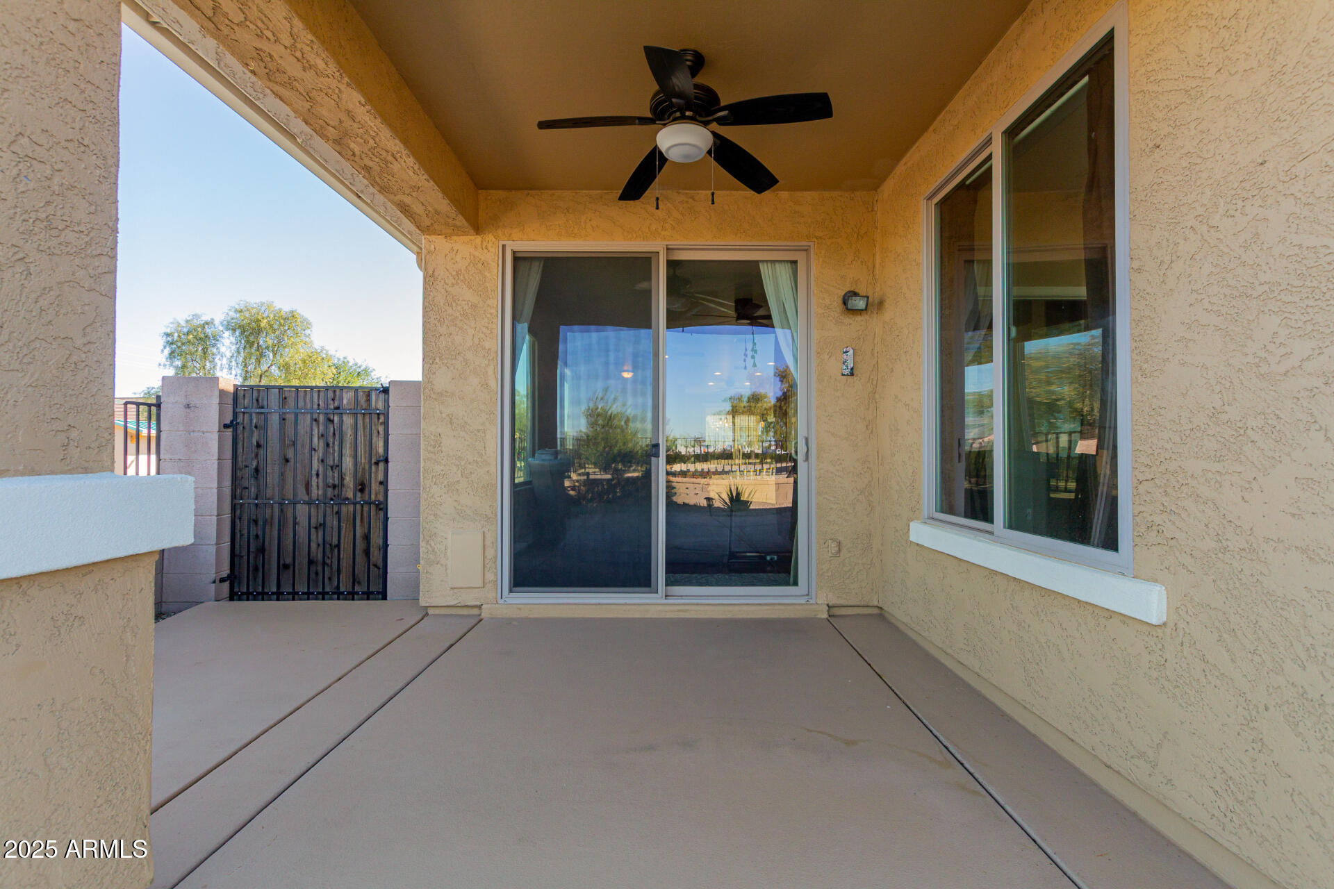 32270 Echo Canyon Road San Tan Valley, AZ 85143 - Photo 25 of 28 a view of a porch with wooden floor and entryway