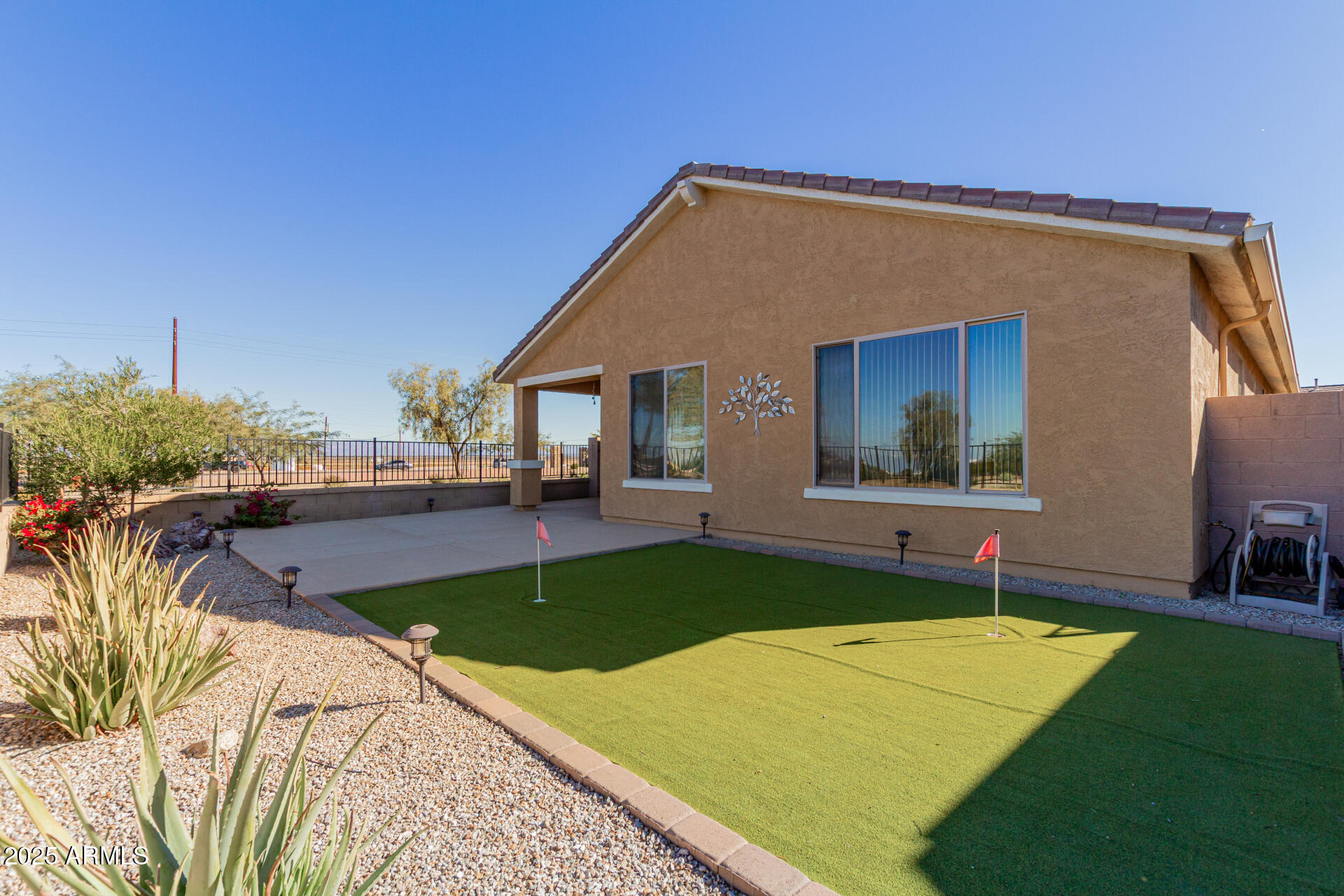 32270 Echo Canyon Road San Tan Valley, AZ 85143 - Photo 26 of 28 a view of a backyard with a patio and plants