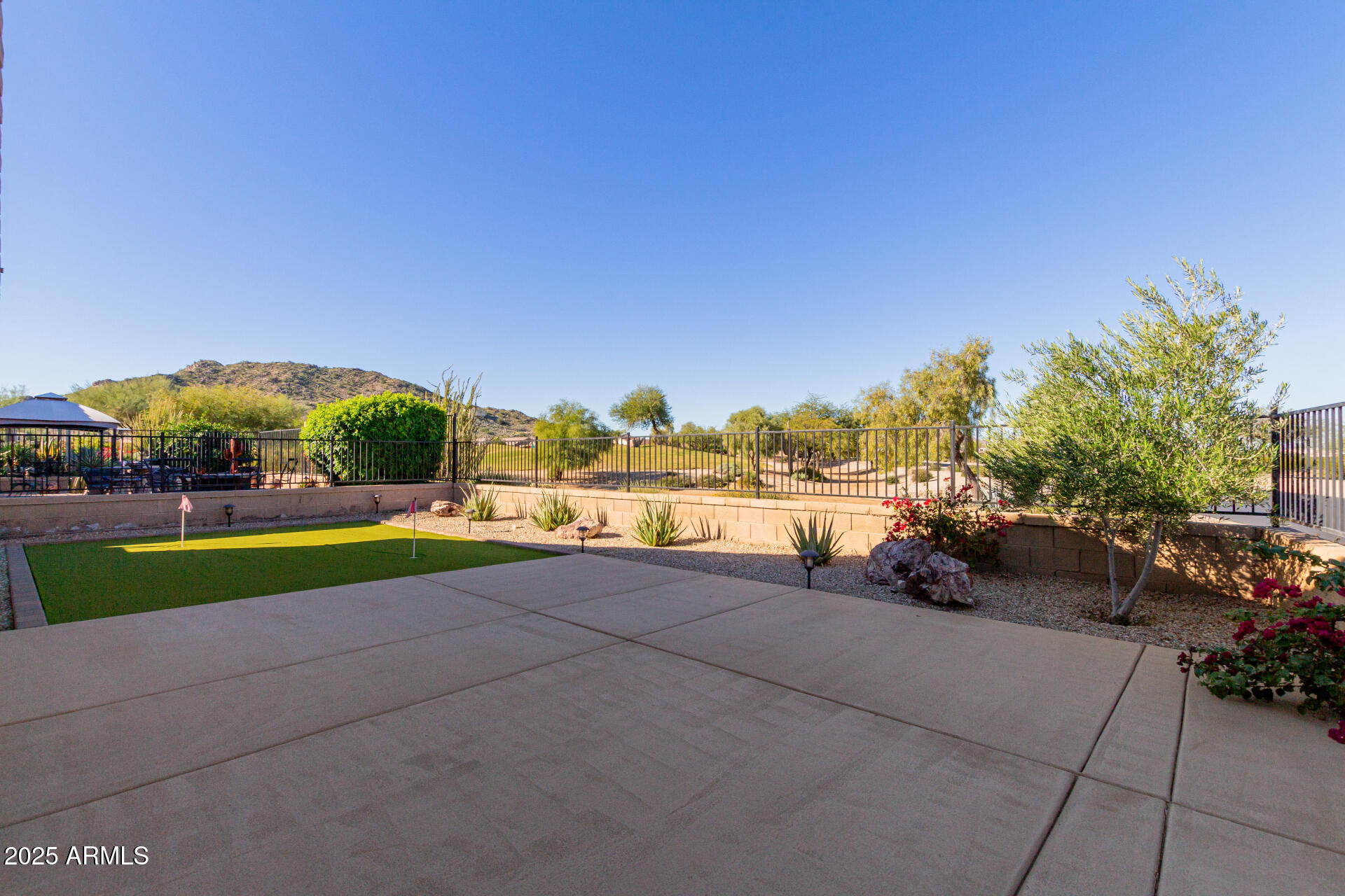 32270 Echo Canyon Road San Tan Valley, AZ 85143 - Photo 27 of 28 a view of a terrace with a garden