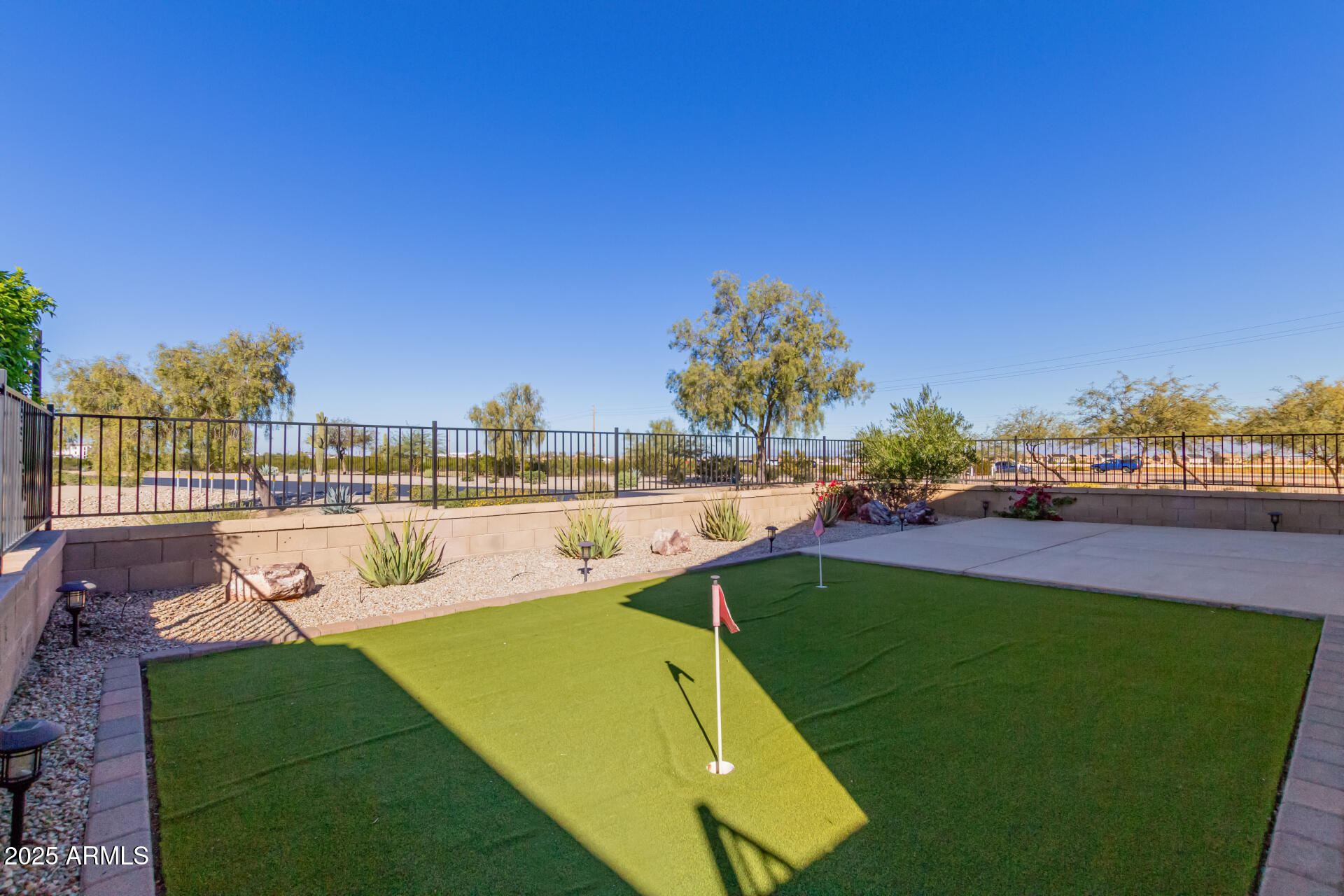 32270 Echo Canyon Road San Tan Valley, AZ 85143 - Photo 28 of 28 a view of a swimming pool with lawn chairs and a big yard