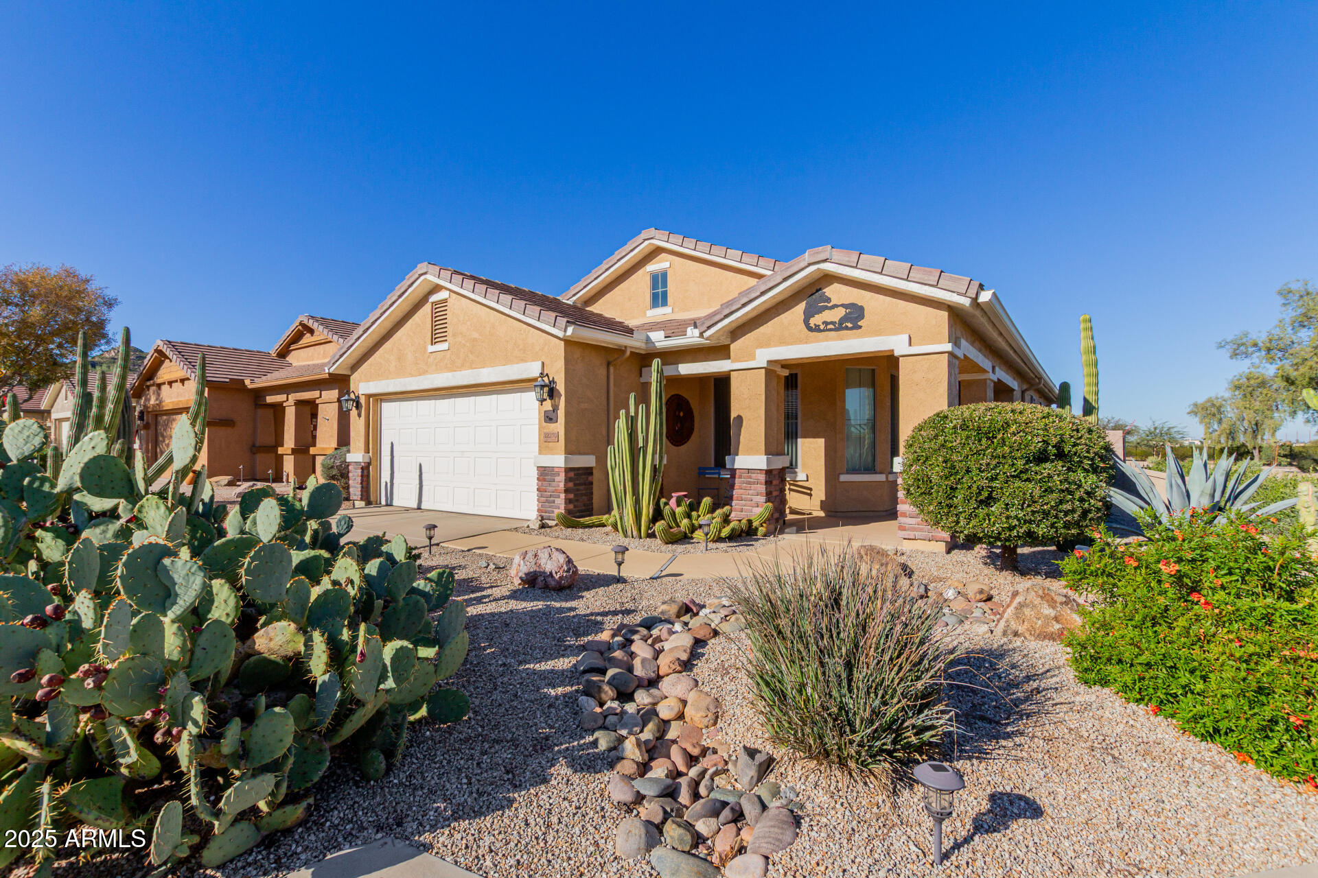 32270 Echo Canyon Road San Tan Valley, AZ 85143 - Photo 3 of 28 a front view of a house with a porch