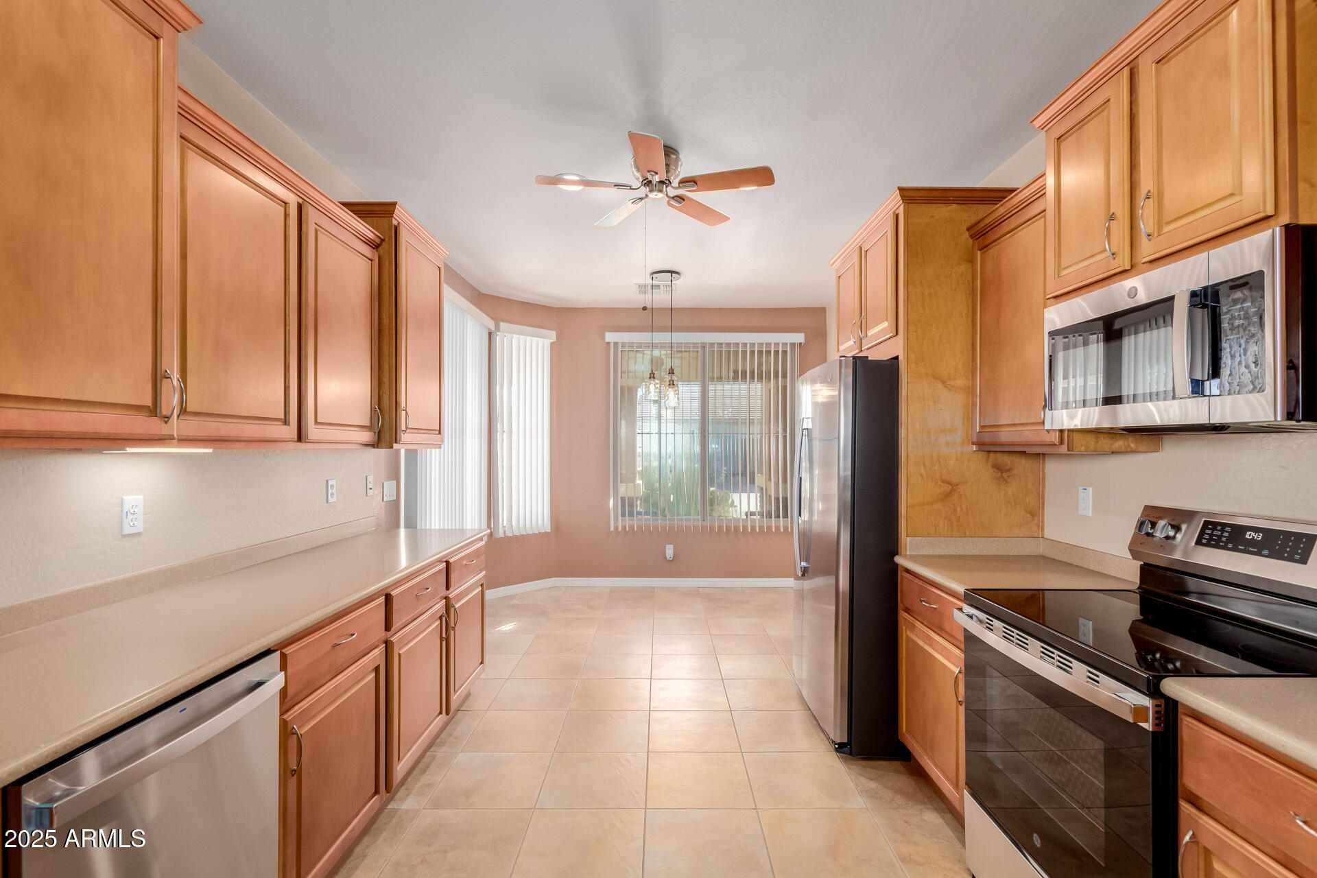 32270 Echo Canyon Road San Tan Valley, AZ 85143 - Photo 9 of 28 a kitchen with stainless steel appliances granite countertop a stove a sink and a refrigerator