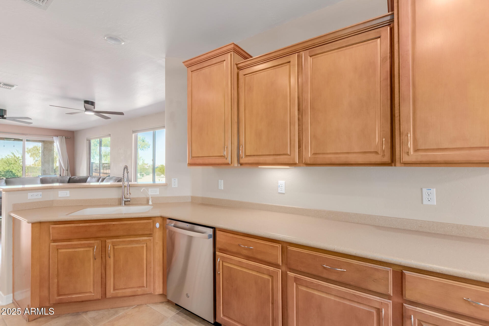 32270 Echo Canyon Road San Tan Valley, AZ 85143 - Photo 10 of 28 a kitchen with stainless steel appliances granite countertop a sink a stove and cabinets