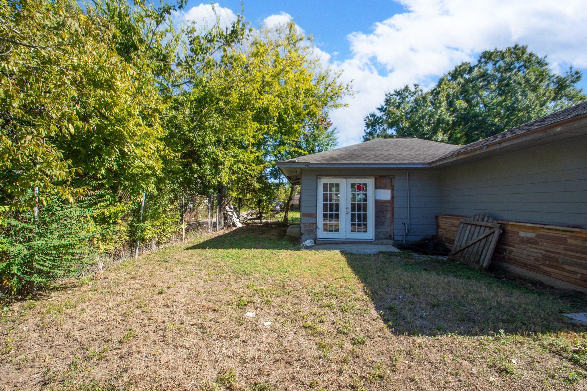 1230 West 4th Street Freeport, TX 77541 - Photo 40 of 49 The white doors lead to a 501 square foot living space. You can use for office, sports room, gaming room, so many possibilities.