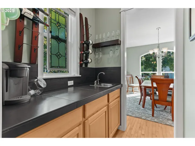 a kitchen with a sink and a large window