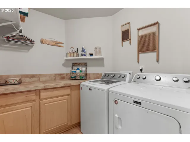 a utility room with dryer and washer