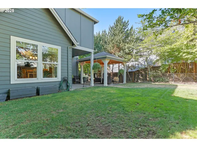 a view of a house with a yard porch and sitting area