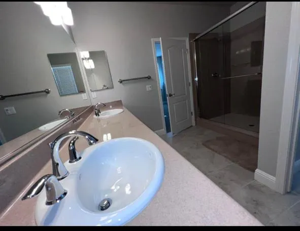 a bathroom with a sink and mirror